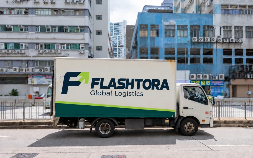 FLASHTORA lettering on the side of a regional box freight truck